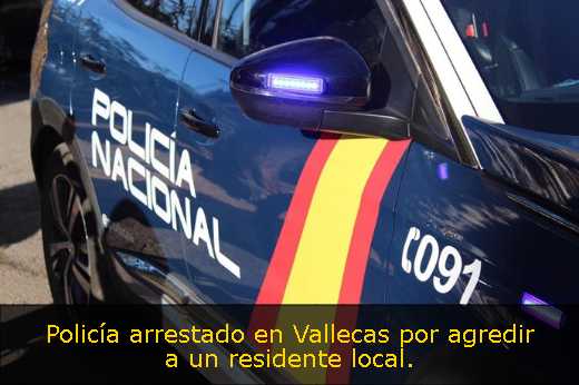 Policía arrestado en Vallecas por agredir a un residente local. 